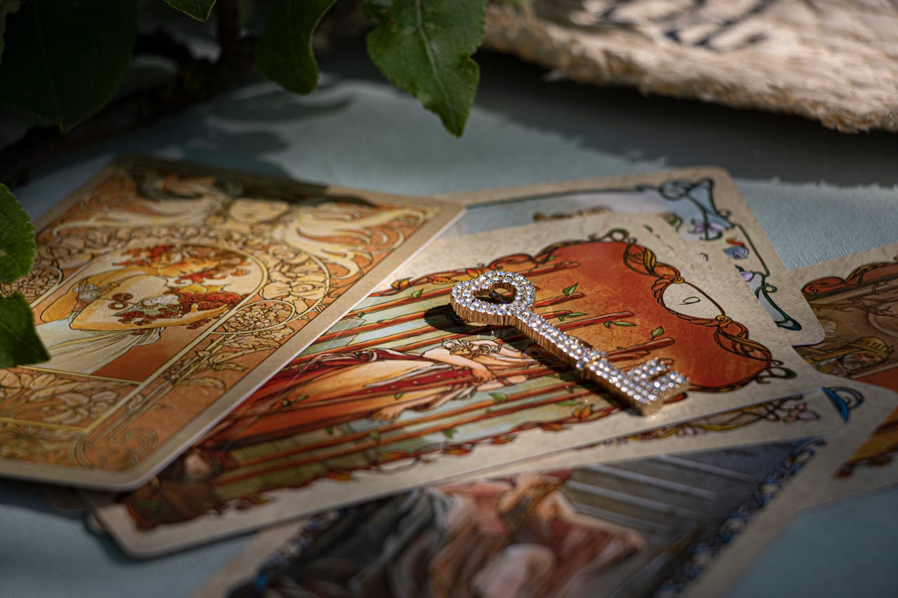 Artistic tarot cards with a sparkling crystal key, evoking mystery and fortune-telling.